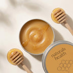 Open Barrier Balm tin showing the golden tallow and honey texture